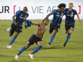 Montreal Impact's Didier Drogba celebrates with teammates Hassoun Camara (6) Michael Salazar (19) and Kyle Fisher (26) after scoring the winning goal against the LA Galaxy during second half MLS soccer action in Montreal, Saturday, May 28, 2016.