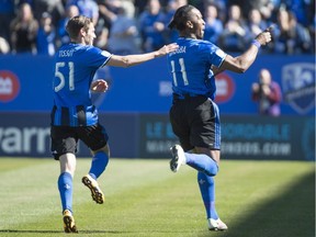 Montreal Impact forward Didier Drogba celebrates his goal against the Colorado Rapids with teammate Maxim Tissot during first half MLS action Saturday, April 30, 2016 in Montreal.