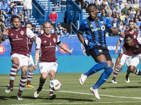 Impact forward Didier Drogba charges for the ball as Colorado Rapids pursue during first-half MLS action Saturday, April 30, 2016, at Saputo Stadium.