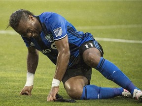 Montreal Impact's Didier Drogba reacts after suffering an injury during second half MLS soccer action against the Philadelphia Union in Montreal, Saturday, May 14, 2016. Drogba will miss the Impact's visit to Orlando City on Saturday with a hip flexor injury.