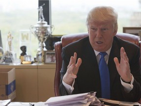 Republican presidential candidate Donald Trump gestures as he speaks during an interview with The Associated Press in his office at Trump Tower, Tuesday, May 10, 2016, in New York.