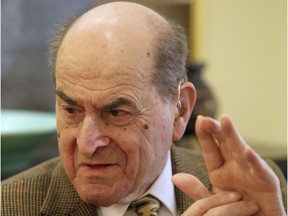 In this Feb. 5, 2014 file photo, Dr. Henry Heimlich describes the manoeuvre he developed to help clear obstructions from the windpipes of choking victims, while being interviewed at his home in Cincinnati. Heimlich recently used the emergency technique for the first time himself to save a woman choking on food at his senior living centre.