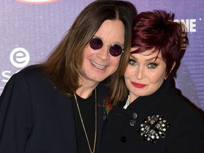 This file photo taken on November 9, 2014 shows British singer Ozzy Osbourne and his wife Sharon posing for pictures as they arrive for the 2014 MTV Europe Music Awards (EMA) in Glasgow, Scotland.