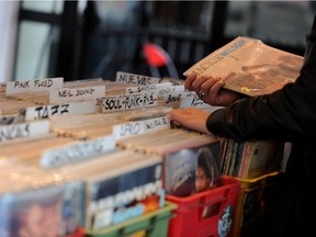 A person looks through vinyl records.