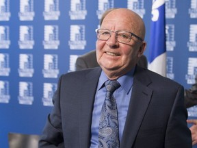 Former Parti Quebecois transport minister and spokesman for the taxi industry, Guy Chevrette smiles after he reacted to a legislation regulating the taxi industry in Quebec City, Thursday, May 12, 2016.