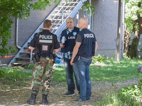 Montreal police at the scene of a home invasion in Pointe aux Trembles May 31, 2016. Police say six people entered a home and at least one person was assaulted and taken to hospital. An infant, who was unharmed, was in the home. Police think it was a domestic dispute.