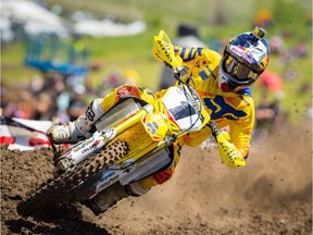 In this photo taken May 30, 2015, and provided by Lucas Oil Pro Motocross Championship, Ken Roczen rides during a 450cc class motocross race at Thunder Valley in Lakewood, Colo. Roczen's family drove their RV home around Europe so he could race dirt bikes. Those early sacrifices have helped turn the German rider into one of the best motocross riders in the world.