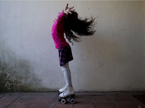 In this Sept. 29, 2015 photo, Luana poses for photos on her roller skates at her home in Merlo, Argentina. Luana says that when one of the girls asked her why she had a penis, a friend jumped in. "She's transsexual," the child explained, nonchalantly. That level of comfort is no doubt in part because Luana herself appears so at ease.