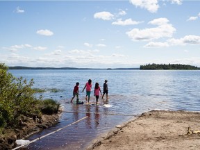 Children play on the shores of the Gouin Reservoir in the First Nation reserve of Opitciwan, 600 kilometres north of Montreal, in August 2013.