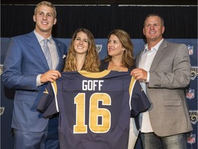 Jared Goff, left, poses for photos with his family after being selected by the Los Angeles Rams as the first pick in the first round of the NFL football draft, in Los Angeles Friday, April 29, 2016. From left to right are: Jared with sister, Lauren Goff, and parents, Nancy Goff and Jerry Goff.