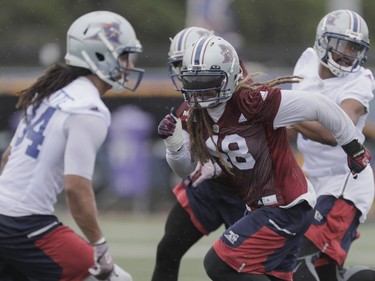 Player Bear Woods, right, takes part in the Montreal Alouettes training camp at Bishop's University in Lennoxville on Sunday, May 29, 2016.