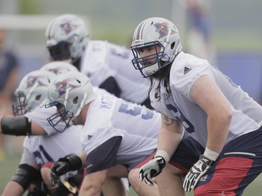 Player Jacob Ruby, right, takes part in the Montreal Alouettes training camp at Bishop's University in Lennoxville on Sunday, May 29, 2016.