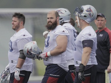 Player Philippe Gagnon, centre, takes part in the Montreal Alouettes training camp at Bishop's University in Lennoxville on Sunday, May 29, 2016.