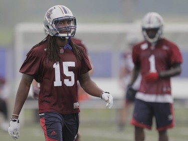 Players Ethan Davis, left, takes part in the Montreal Alouettes training camp at Bishop's University in Lennoxville on Sunday, May 29, 2016.