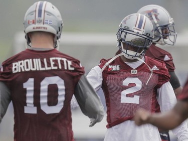 Players Jovon Johnson, right, and Marc-Olivier Brouillette, left, take part in the Montreal Alouettes training camp at Bishop's University in Lennoxville on Sunday, May 29, 2016.