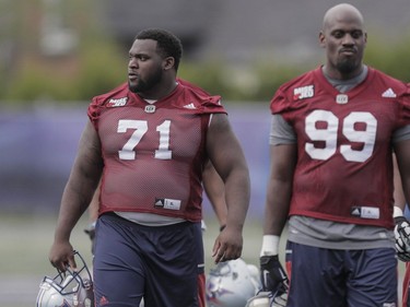 Players Mitchell Jeter, left, and Jesse Joseph, right, take part in the Montreal Alouettes training camp at Bishop's University in Lennoxville on Sunday, May 29, 2016.