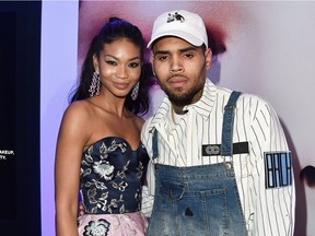 Chris Brown with Chanel Iman in Cannes on Wednesday. The singer laughed off reports he had been kicked off a jet in Miami.