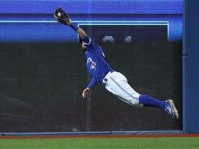 Kevin Pillar of the Toronto Blue Jays makes a diving catch in the ninth inning during MLB game action against the Los Angeles Dodgers on May 7, 2016, at Rogers Centre in Toronto.