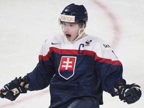 Slovakia's Martin Reway celebrates after scoring against Germany during first period preliminary round hockey action at the IIHF World Junior Championship in Montreal, Tuesday, December 30, 2014. The Montreal Canadiens announced Wednesday that playmaking forward Reway has signed a three-year contract with the club.
