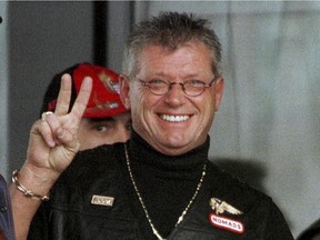 Maurice (Mom) Boucher, the reputed head of the Nomads chapter of the Hells Angels in Quebec, flashes peace sign in 2000.