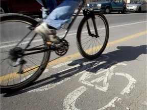 A cyclist rides along de Maisonneuve Blvd. Plans are afoot to construct more paths downtown.