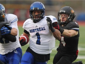 Montreal Carabins' Sean Thomas-Erlington, centre, was named Team East's offensive player of the Canadian Interuniversity Sport East-West Bowl on Saturday, May 14, 2016, after rushing for 93 yards on nine carries.