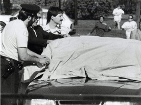 May 13, 1991: Lawyer Sidney Leithman lies dead in his car after being shot. The girls running in the background are his daughters yelling to police, "that's my father."