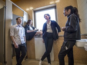 Westmount High School, students Nilani Uthayakumar, right, Adrienne Buell, second right, Kyra Hedley-Cain, second left, and Eden Alati-Coventry, left, chat in the new gender-neutral washroom at Westmount High School on Wednesday May 4, 2016, in Montreal. The school created this space after several students told the administrators that they did not feel comfortable using the existing bathrooms.