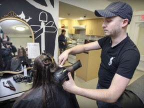 Jean Scarabin styles the hair of Ashlynn Parsons at Anne's House in Montreal on April 22, 2016. Scarabin, who works on movie sets, volunteers one afternoon a month to cut and style the hair of residents of the house, which provides apartments for 30 women who struggle with mental-health issues, addictions and homelessness.