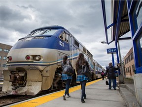Passengers arrive to board the train heading to Saint-Jérôme at the Parc Station in Montreal on Monday, April 27, 2015.