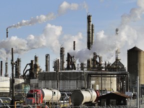 Smoke billows from stacks at the Suncor refinery in Montreal in 2014.