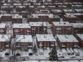 A winter view of homes and residential apartment buildings after snow fall in the borough of Cote-des-Neiges seen from the K Pavilion of the Jewish General Hospital in Montreal on Monday, January 18, 2016.