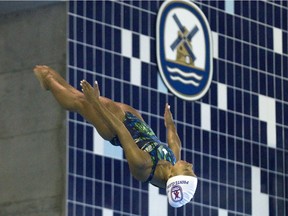 Jennifer Abel dives during training at the Pointe Claire Aquatic Centre in Pointe Claire west of Montreal, Thurday June 25, 2015.  She was among other divers from Pointe Claire who are preparing for the Pan Am Games which start in Toronto July 10.  (Phil Carpenter / MONTREAL GAZETTE)