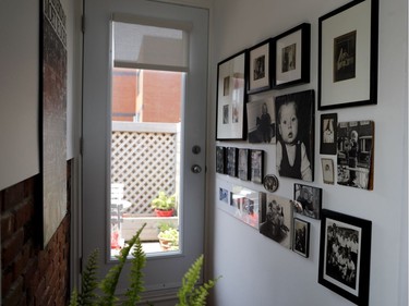 Photographs that range from her grandparents to her grandchildren line the walls of Lies Ouwerkerk's home. (Allen McInnis / MONTREAL GAZETTE)