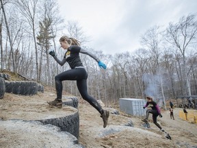 Athlete Gaëlle Corbeil demonstrates the "Rubber Mountain" obstacle at the Course Extreme obstacle race in Saint-Calixte, 80 kilometres north of Montreal on Sunday, May 15, 2016. The Course Extreme is a 5-kilometre circuit with 42 obstacles that aims to be accessible to participants of all fitness and skill levels. (Dario Ayala / Montreal Gazette) ORG XMIT: 56084
