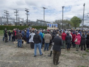 About 150 concerned residents in Dollard-des-Ormeaux gathered to protest plans to build electrical towers for Hydro Quebec's 315 kV transmission line and the redevelopment of the St-Jean substation Sunday, May 16, 2016.  (Peter McCabe / MONTREAL GAZETTE)