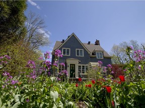 A garden envelopes the property of a heritage home on Lakeshore in Beaconsfield, Tuesday May 17, 2016. (Phil Carpenter/MONTREAL GAZETTE)