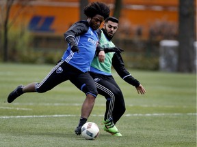 Montreal Impact's Michael Salazar, left, fights off Víctor Cabrera during a team practice in Montreal on Tuesday May 17, 2016.