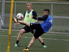 Impact rookie Kyle Fisher, left, practising with Lucas Ontivero last week at the team's training facility, is is normally a centre back but he will move outside against the L.A. Galaxy Saturday night at Saputo Stadium.