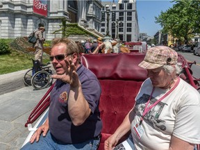 Calèche drivers including Danny Seguin and Judy Waldon protested Mayor Denis Coderre's decision to order a one-year ban on their business in front of Montreal's City Hall on Tuesday, May 24, 2016.