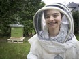 Alexis Ciarello and her new bee hive – with its 5,000 bees – she received as a birthday gift at her home in St-Lazare.  (Peter McCabe / MONTREAL GAZETTE)