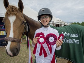 Heather Oswald of Rigaud, poses with her ribbons she won competing at the St-Lazare Horse Show, on her horse, Brookside look at me, in St-Lazare on Sunday, May 29, 2016. (Peter McCabe / MONTREAL GAZETTE)