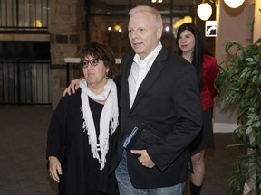 PQ leadership candidate Jean-François Lisée, right, arrives with his campaign director France Amyot, left, for the PQ council for riding presidents held at the Best Western Hotel in Drummondville on Sunday, May 29, 2016.