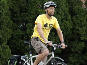 Etienne Portelance sits on his bike at John Abbott College on May 30, 2016. Portelance crashed his bike while crossing a crosswalk in Dorval, leaving his face and legs with several cuts. The tiny glass beads imbedded in the paint, reflect light, making it easier to see for motorists but make the paint slippery. (Allen McInnis / MONTREAL GAZETTE)