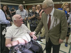 Quebec Health Minister Gaétan Barrette, right, chats with Canadian Armed Forces veteran Stuart Vary following a press conference at the Ste. Anne Hospital in Ste-Anne-de-Bellevue, west of Montreal, Monday May 30, 2016.  (Phil Carpenter/MONTREAL GAZETTE)