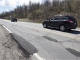 Cars goes past patched roadwork on Harwood Road in Vaudreuil on Saturday, May 7, 2016 near Chemin de la Petite-Riviere . (Pierre Obendrauf / MONTREAL GAZETTE)