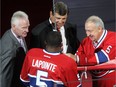 Larry Robinson, left, with Serge Savard and P.K. Subban at the Bell Centre jersey retirement ceremony of Guy Lapointe, right, in 2014. 
The Canadiens cancelled a job interview with Robinson in 2012 and instead hired J.J. Daigneault as an assistant coach.