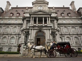 A calèche drives past Montreal city hall Thursday, Oct. 4, 2012.