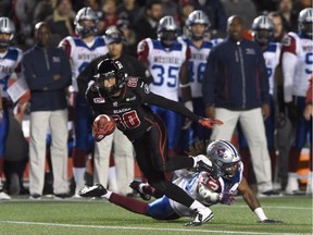 Ottawa Redblacks' Chris Williams (80) breaks away from Montreal Alouettes' Terry Johnson (43) during first half CFL football action in Ottawa on Thursday Oct. 1, 2015.