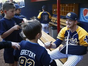 Quebec Capitales outfielder Trevor Gretzky signs autographs at the Stade Municipal in Quebec City on Sunday May 22, 2016.